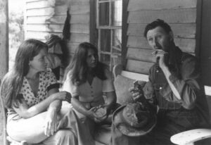 Soon after meeting Ray, storytellers Connie Regan-Blake and cousin Barbara Freeman journeyed to Ray's front porch in Watauga County, NC to hear more stories. (Photo by: Bob Hutchinson)